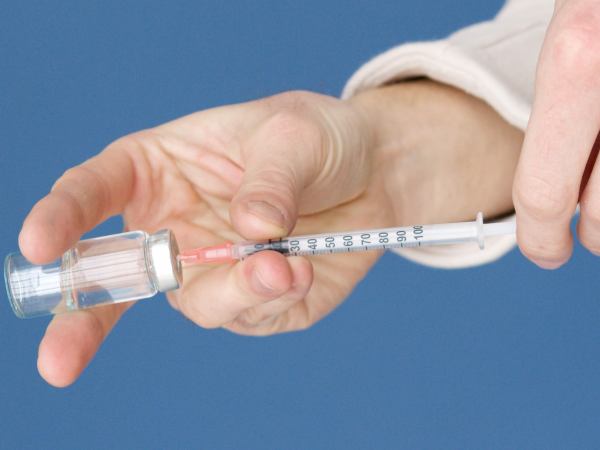 Medication being drawn up into a syringe